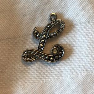 Antique cursive “L” pendant.